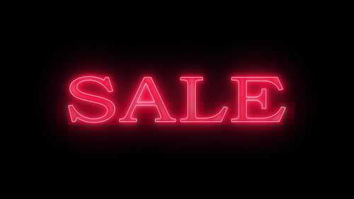 Bright Red Neon Sale Sign Over Black