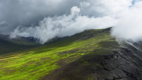 Clouds Above Green Hills Mountain Range Aerial View