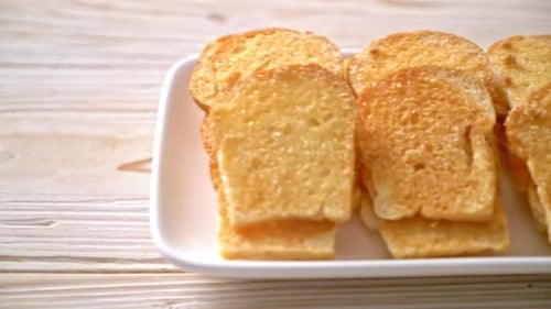 Golden Toast Slices on a White Plate