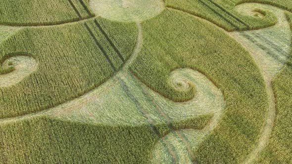 Aerial view over wind patterns blowing across Etchilhampton spiral ...