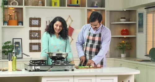 Couple Cooking Together in Home Kitchen