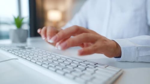Female hands typing on a computer keyboard. Concept of remote work.