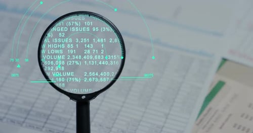 A hand with a magnifying glass passes over a financial newspaper and financial bag with a business
