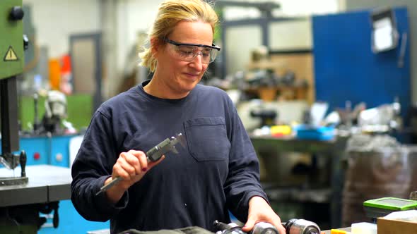 Female factory worker operator working in numerical control sector ...