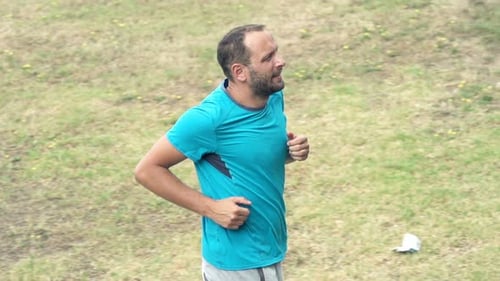 Man Jogging In Park