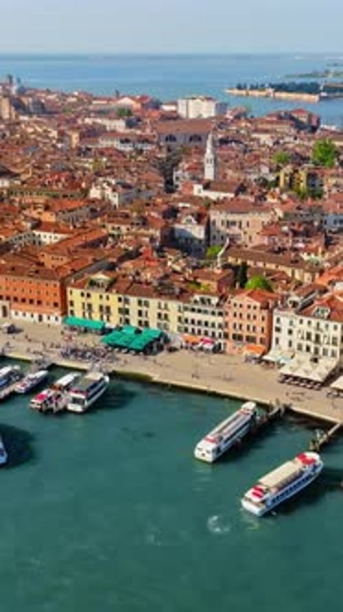 Aerial drone view of boats near Venice City, Italy on a sunny day. Vertical