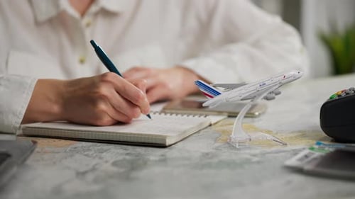 Trekking, Middle Aged Man Sleepy Write Travel Plans In A Diary At An Insurance Agency, General Angle