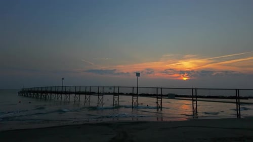 The Pier On The Beach At Dawn