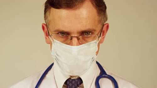 Doctor With Glasses and Mask Close Up
