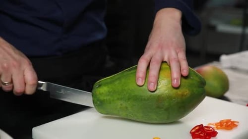 Chef Cuts Fresh Papaya Fruit With Knife