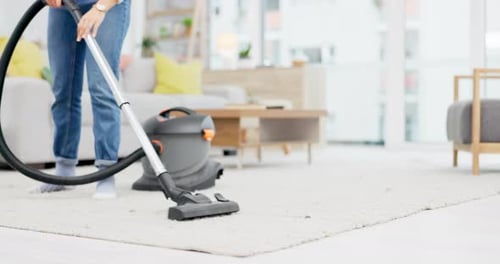 Vacuuming a White Rug in Bright Room