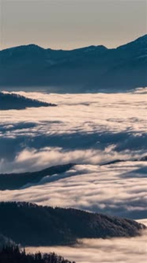Foggy Clouds Flowing Through Mountain Valley Like a River