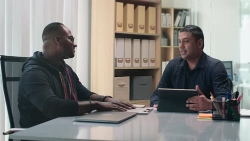 Two Businessmen Meeting at Modern Office