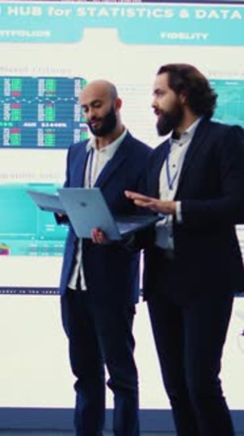 Vertical Video Team of Investors Analyzing Profit Amount and Making Decisions