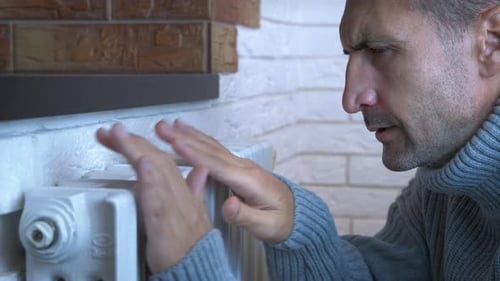 Male Warming By Central Radiator Indoor