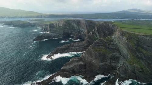 Aerial view of kerry cliffs and ocean waves, Ireland.