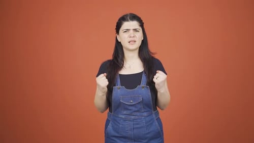 Woman getting angry at camera.