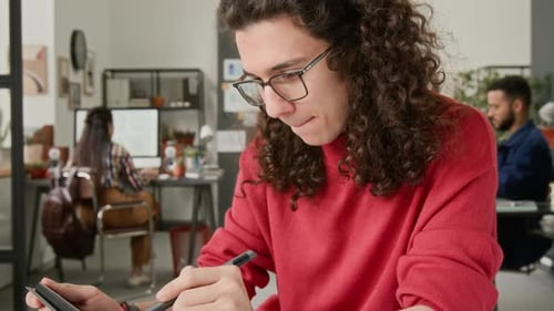 Designer Working on App Interface with Digital Tablet