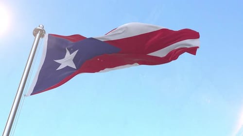 Bandera de Puerto Rico ondeando en el cielo