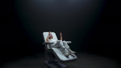 Woman Relaxing in Futuristic Chair with AR Glasses