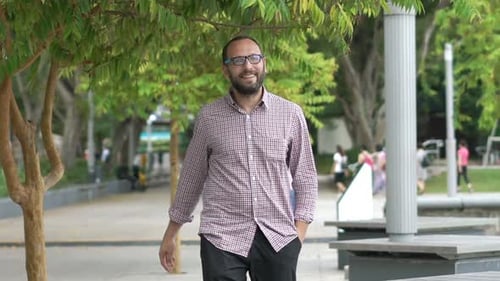 Happy Handsome Man Walking in City Park,