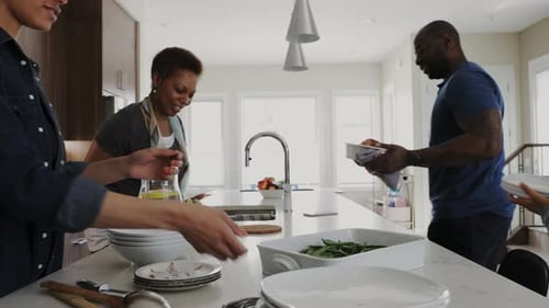 Family Preparing and Sharing Food in a Modern Kitchen