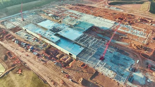 Aerial View of Construction Site with Assembly of Modern Large Factory Structure for Production and