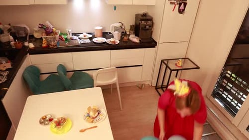 Woman and Child Celebrate Birthday with Balloons