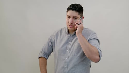 Man Talking on Cell Phone Indoors