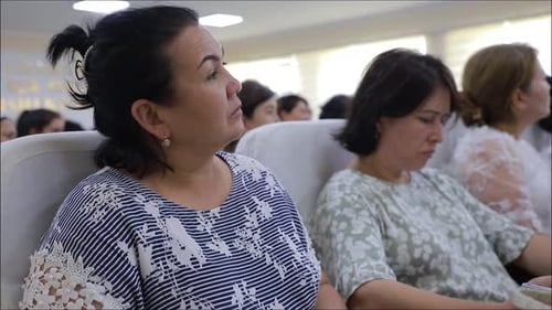 Citizens are listening to an important topic in the assembly hall