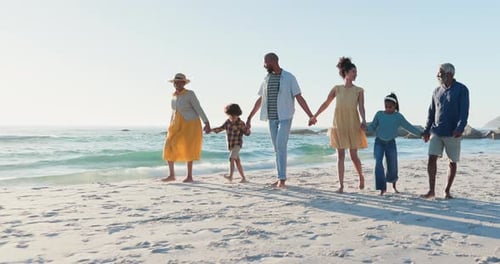 Holding hands, love and big family walking at the beach with freedom, fun and bond