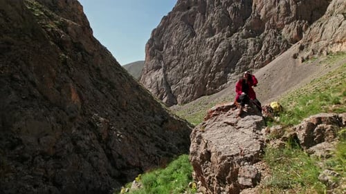 Hiker Sitting Rock Looking