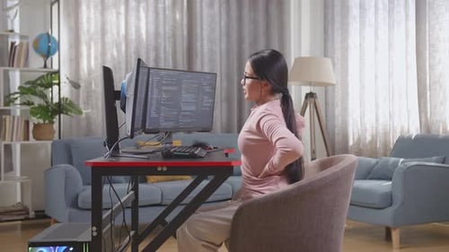Asian Teen Girl Programmer Having A Backache While Creating Software Engineer Developing App