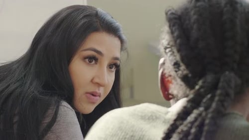Woman Speaking to Someone with Braided Hair