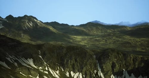 Mountain Landscape with Diverse Terrain and Clear Blue Sky at Sunset