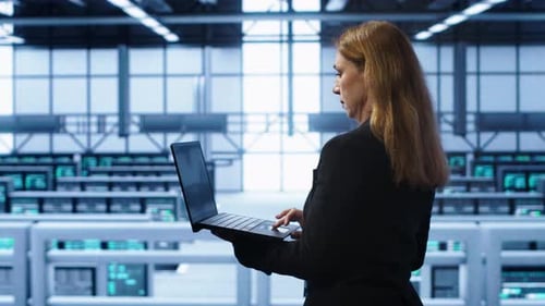 IT Specialist in Server Hub Monitoring Server Infrastructure Using Notebook