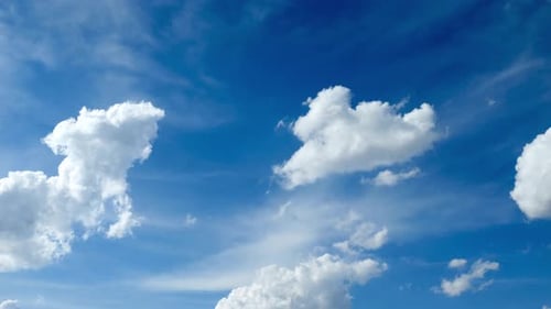 Puffy Clouds on Blue Sky