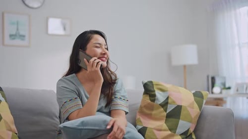 Woman Talking on Cell Phone at Home