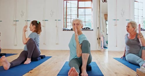 Exercise, yoga and senior women in class for wellness, healthy body and stretching on floor
