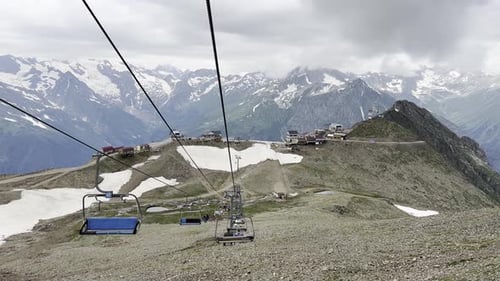 Scenic Mountain Lift Ride Offers Stunning Views of Peaks and Valleys