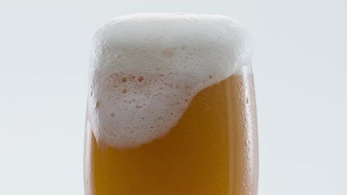 Closeup Hoppy Unfiltered Beer Foaming in Glass Super . Foam Alcohol