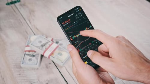Hands Analyze Stock Market Chart on Phone