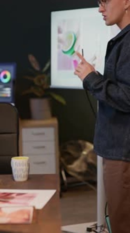 Man Presenting Reference Images to Producer