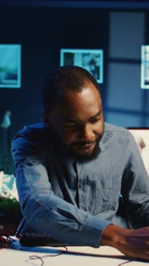 Happy Man Presenting Colorful Computer Keyboard