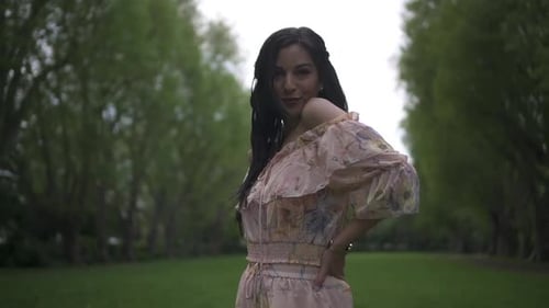 Woman Posing in Floral Dress in Green Park