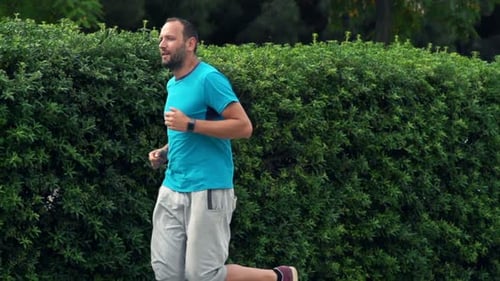 Man Jogging In City Park, Super Slow Motion 240fps