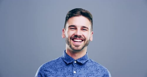 Happy Young Man Smiling and Laughing