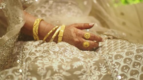 Golden Jewelry on Elegant Bride's Hand