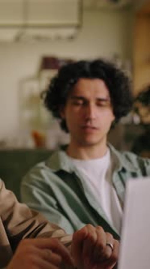 Young Adults Working Together in Modern Workplace