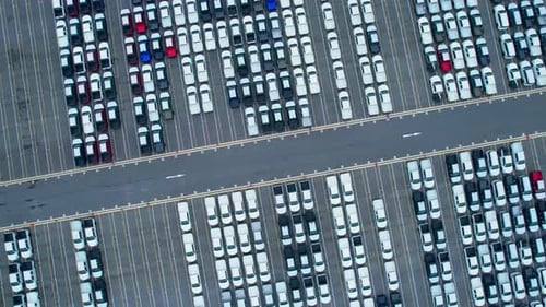 Drones flying over of many vehicles at parking lots
